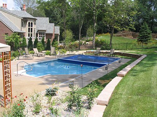 An automatic pool cover can save you money and resources.