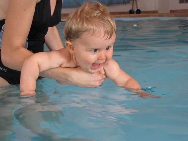 Teaching toddlers to swim is a recommended pool safety tip.