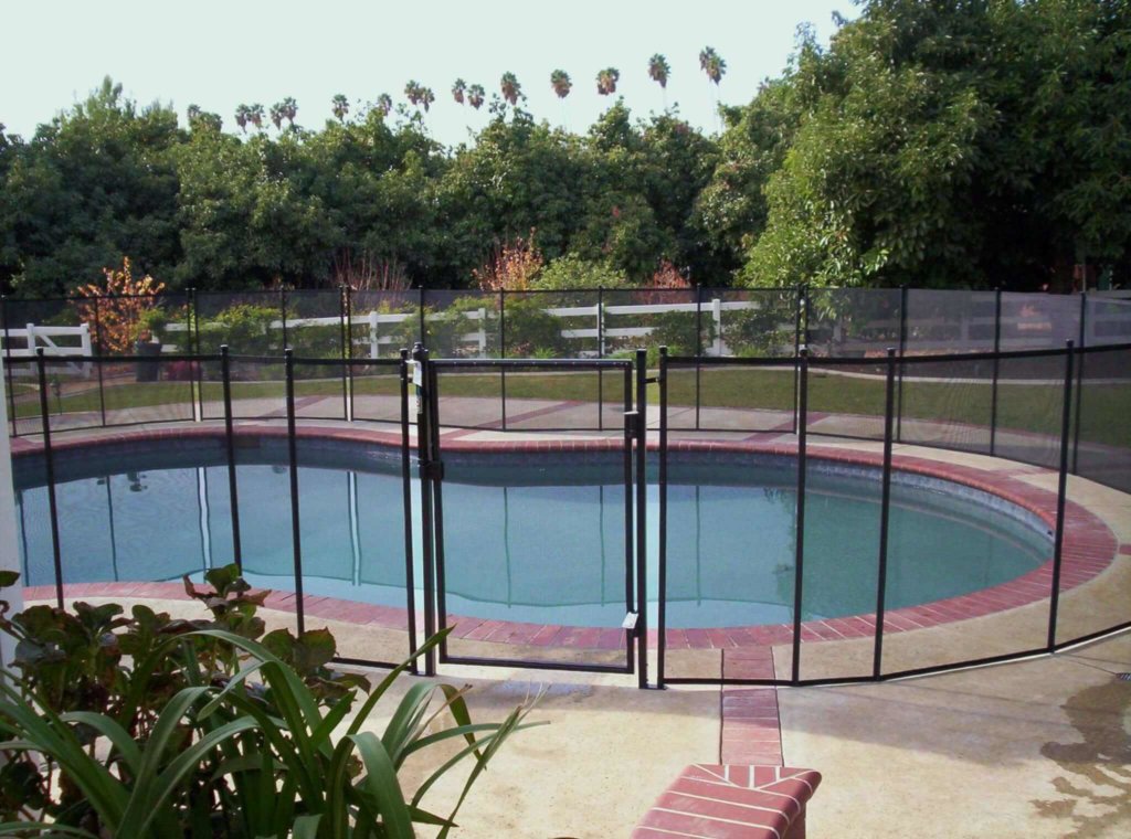 How a Pool Cover and a Pool Fence Can Enhance Safety and Security