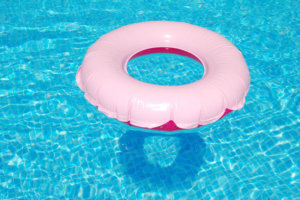 Pink inflatable ring in a swimming pool