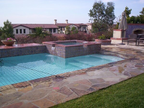 Backyard swimming pool of a hillside home