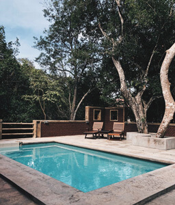 Swimming pool with a pool door alarm