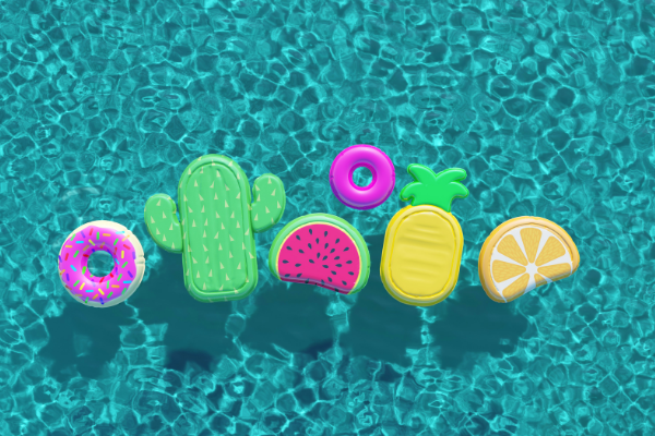 neon colored pool floats floating in a swimming pool
