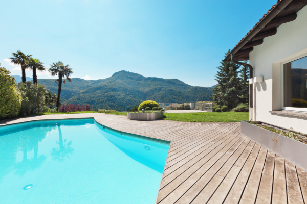 mountainside home with a backyard pool