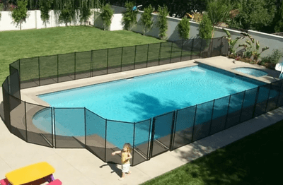 Black mesh pool fence for irregular shaped pool