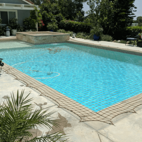Safety Net Shown installed in Tan color on pool with raised spa
