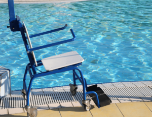 Blue wheelchair sitting beside a swimming pool
