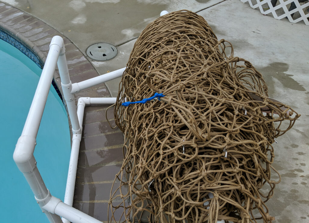 Net on Roller, waiting to be put over the pool
