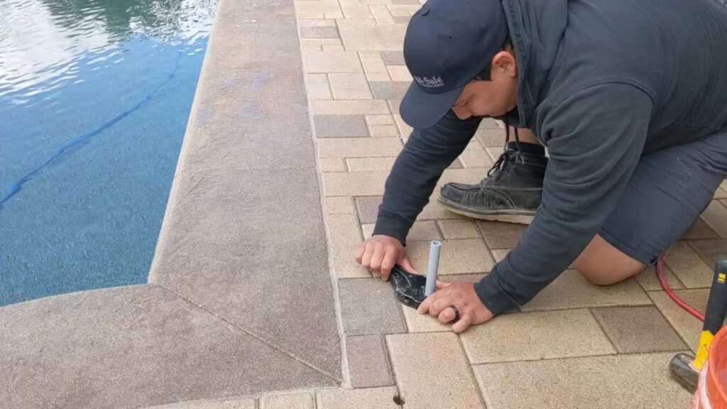 How to Install a Pool Fence in Pavers - Cut your PVC