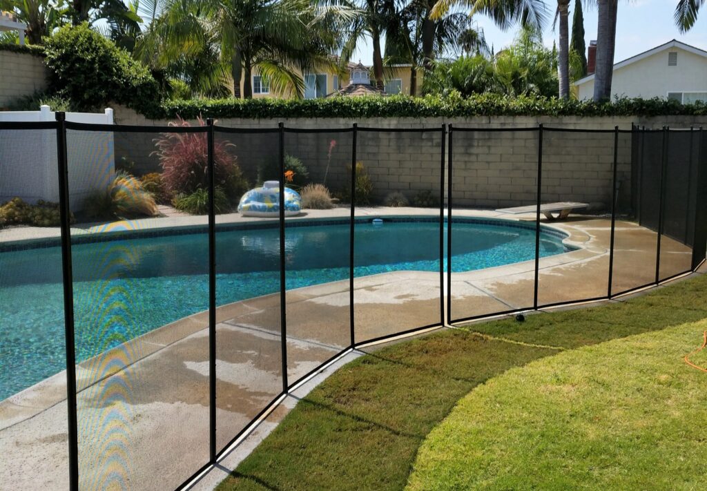 Black Pool Fence surrounding the pool for optimum safety