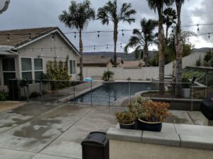 Backyard swimming pool on a hot summer day