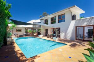 Backyard swimming pool on a hot summer day