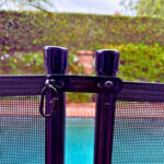 Quick Lock Latch Kit on black fence