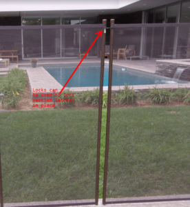 Pool fence padlock securing Section Latch