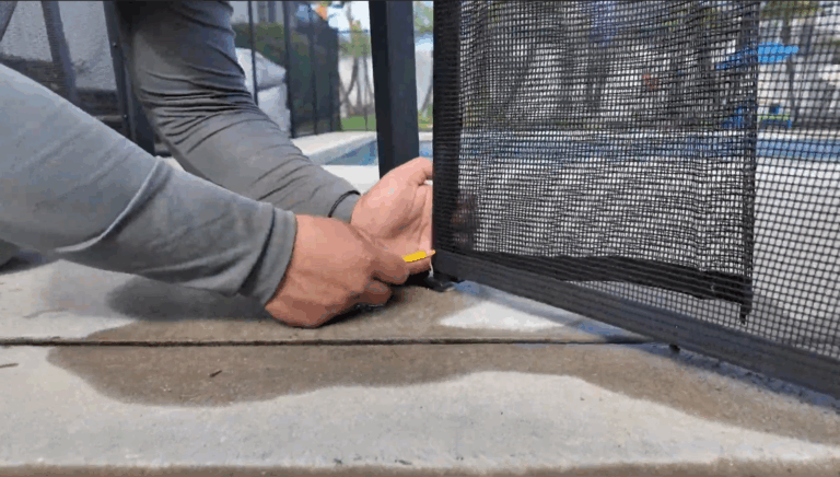 Installer wraps mesh around pole and marks it