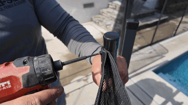 Installer attaches both moldings and mesh to pole