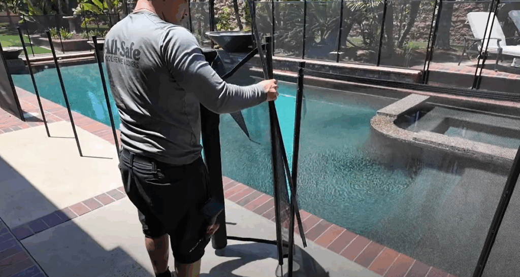 Installer inserting poles into pool deck.