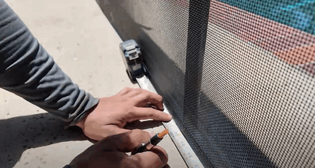 Installer measuring and marking border.