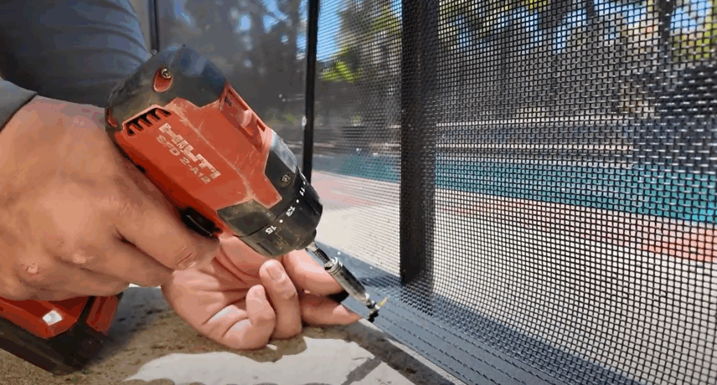 Installer pre-drilling hole in bottom of mesh border
