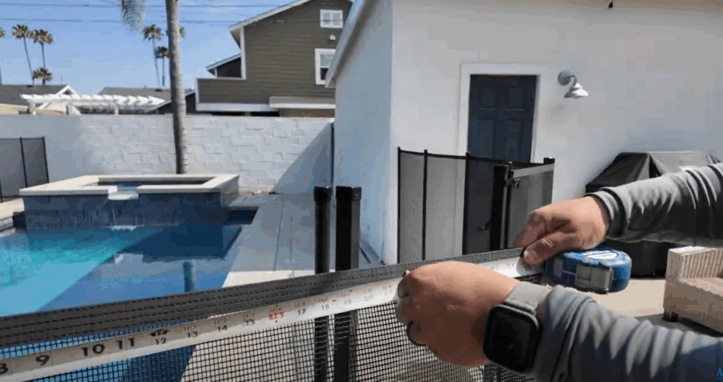Installer measuring and marking mesh.