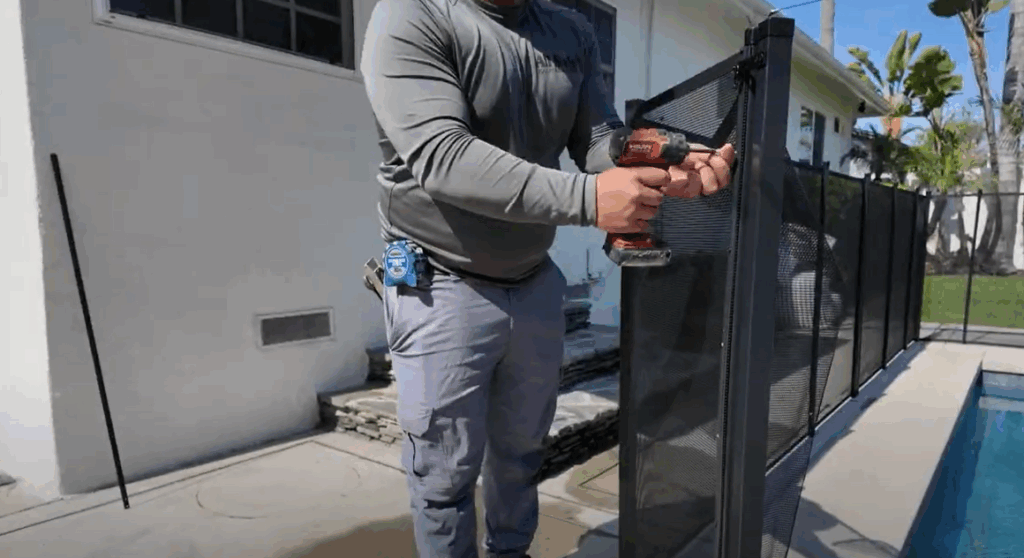 Installer shown inserting screws.