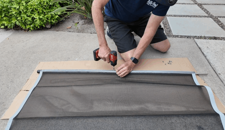 Starting in the middle, installer finishes screwing in molding