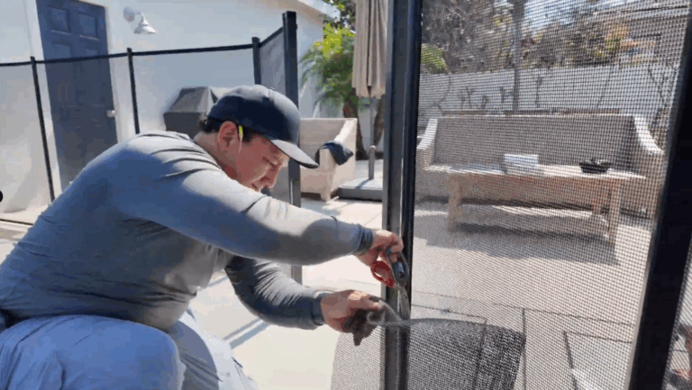 Installer carefully cuts excess mesh