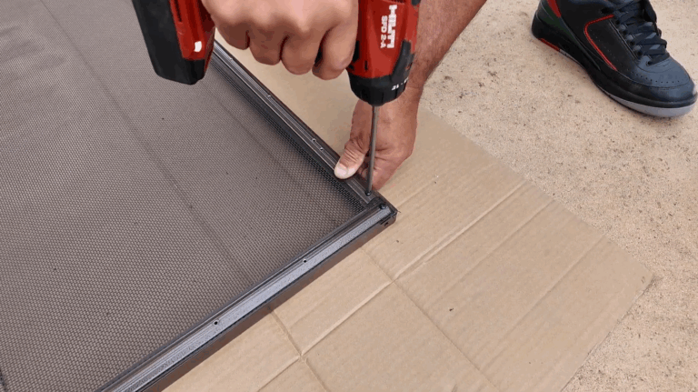 Installer inserts screws into the holes at each end of the molding
