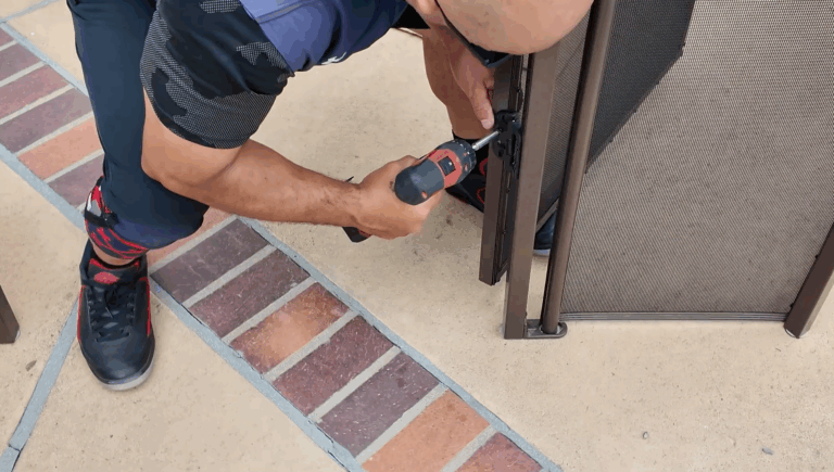 Installer screwing in inside hinges