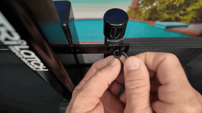 Installer uses the carabiner to move the eye-screw to horizontal position
