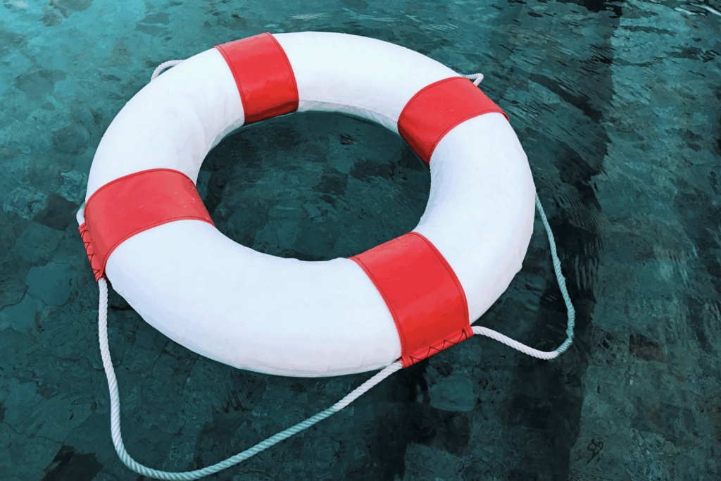 Pool with a safety flotation device floating in it