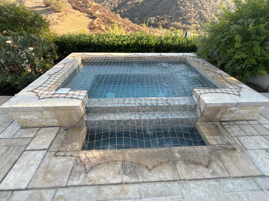 Tan Safety Net Installed on Spa with spillway