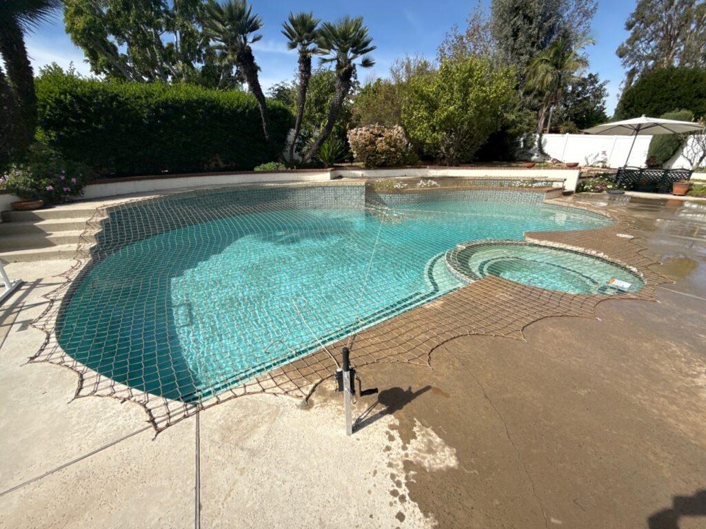 Tan Net on Pool with Stairs and a spa