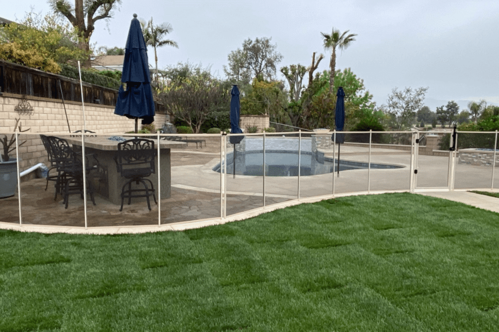 white mesh removable pool fence installed by All-Safe