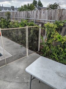 Installed Round Terminating Post Installed at wood fence