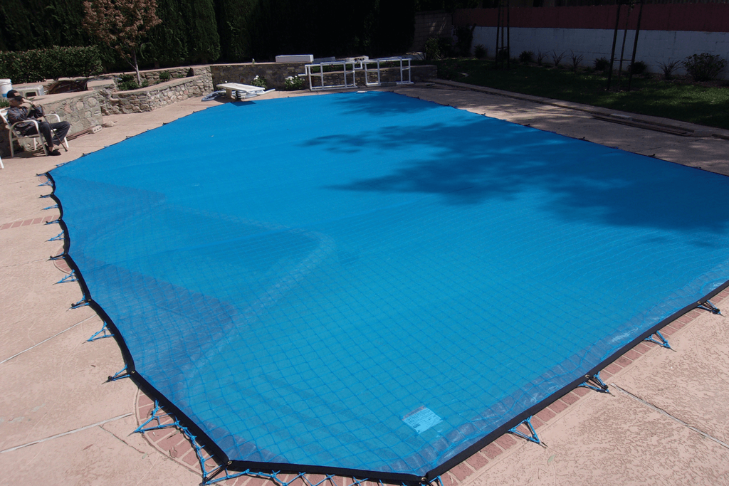 All-Safe installed pool net with a blue leaf cover installed over it