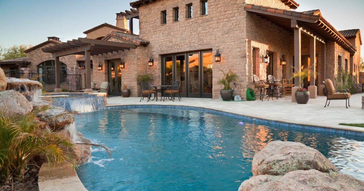 Brick home with swimming pool in the backyard