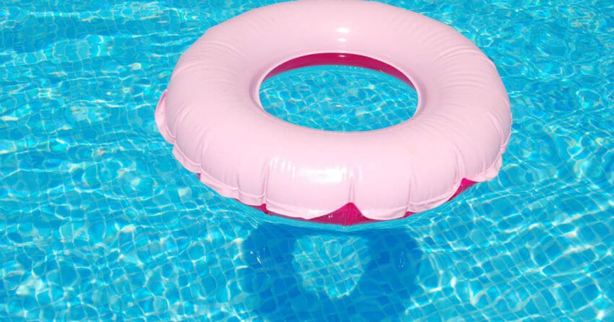 Pink inflatable ring in a swimming pool