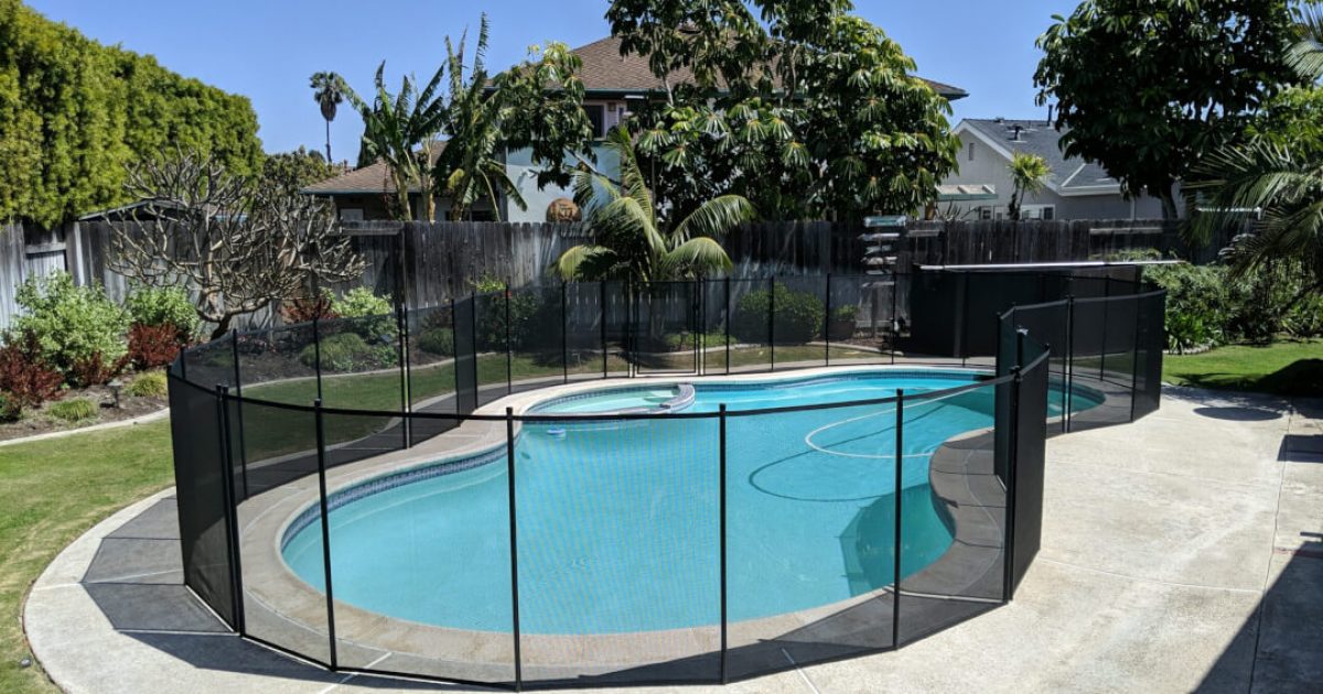Black pool fence installed on an irregular shaped pool