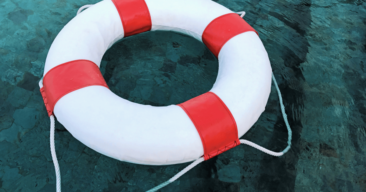 Pool with a safety flotation device floating in it