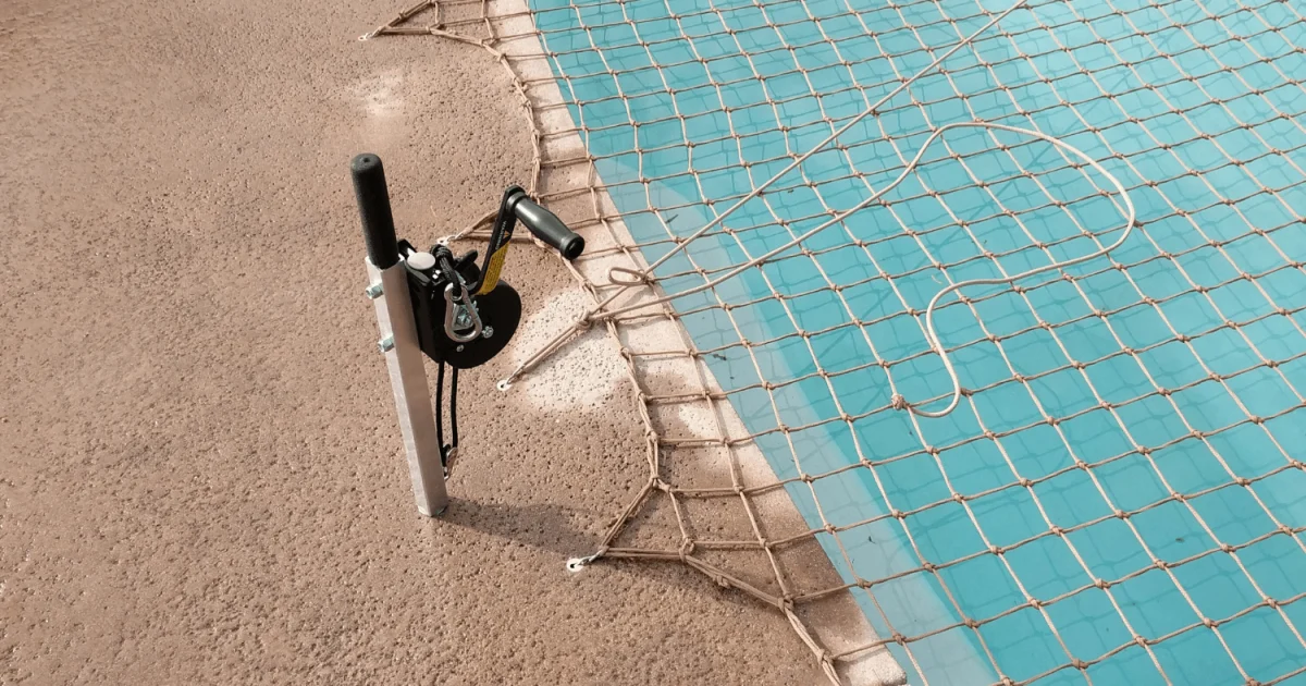 tan pool net installed over a swimming pool with Titan Tool