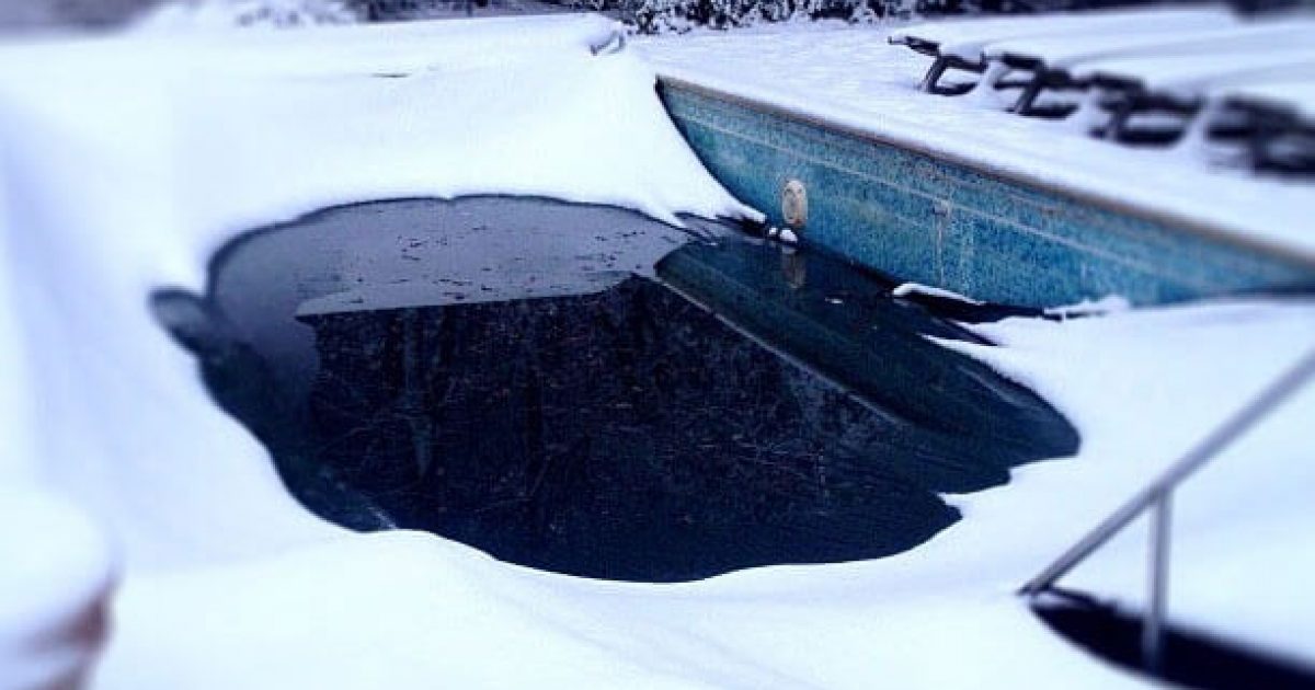 backyard pool with retracting automatic pool cover