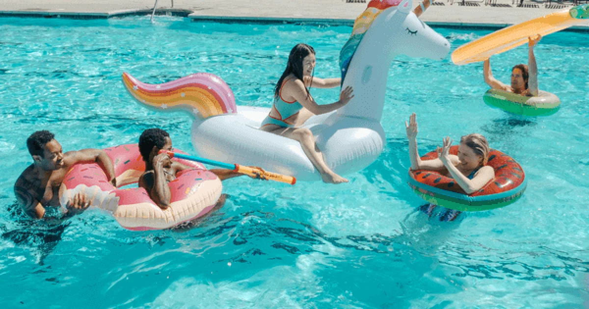 family enjoying swimming pool fun on floats