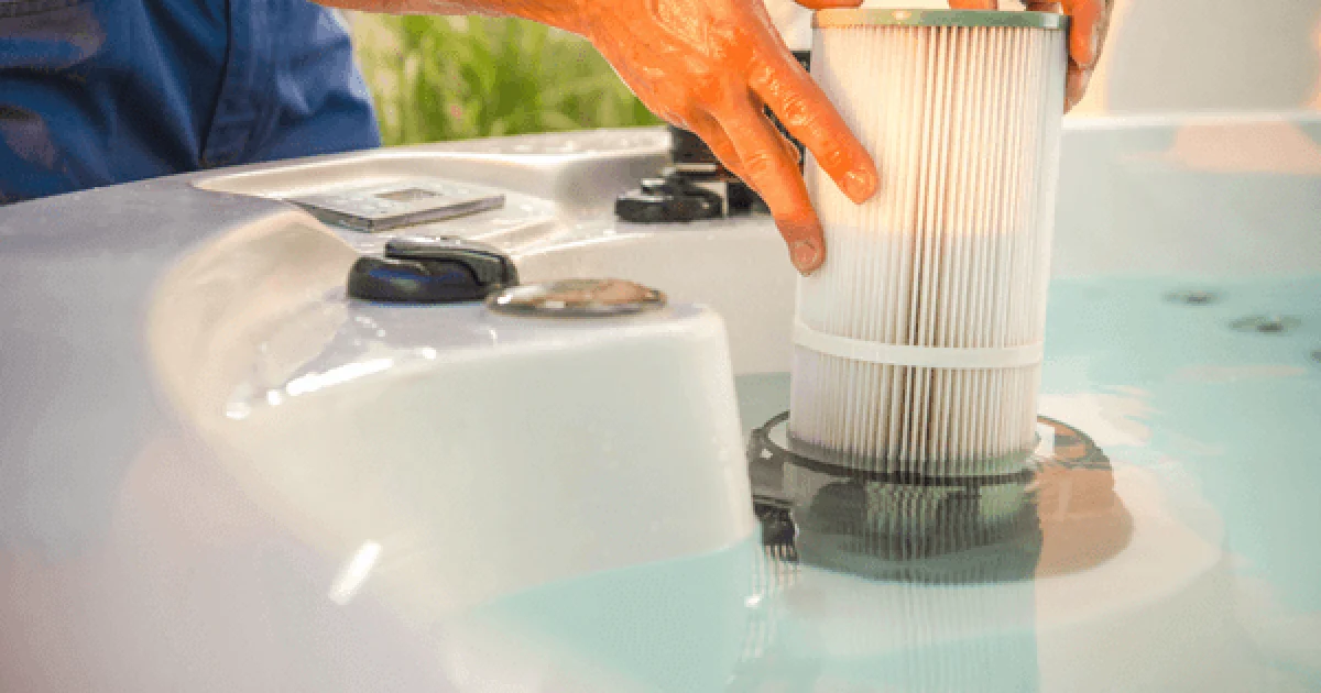 man performing hot tub maintenance and checking filters