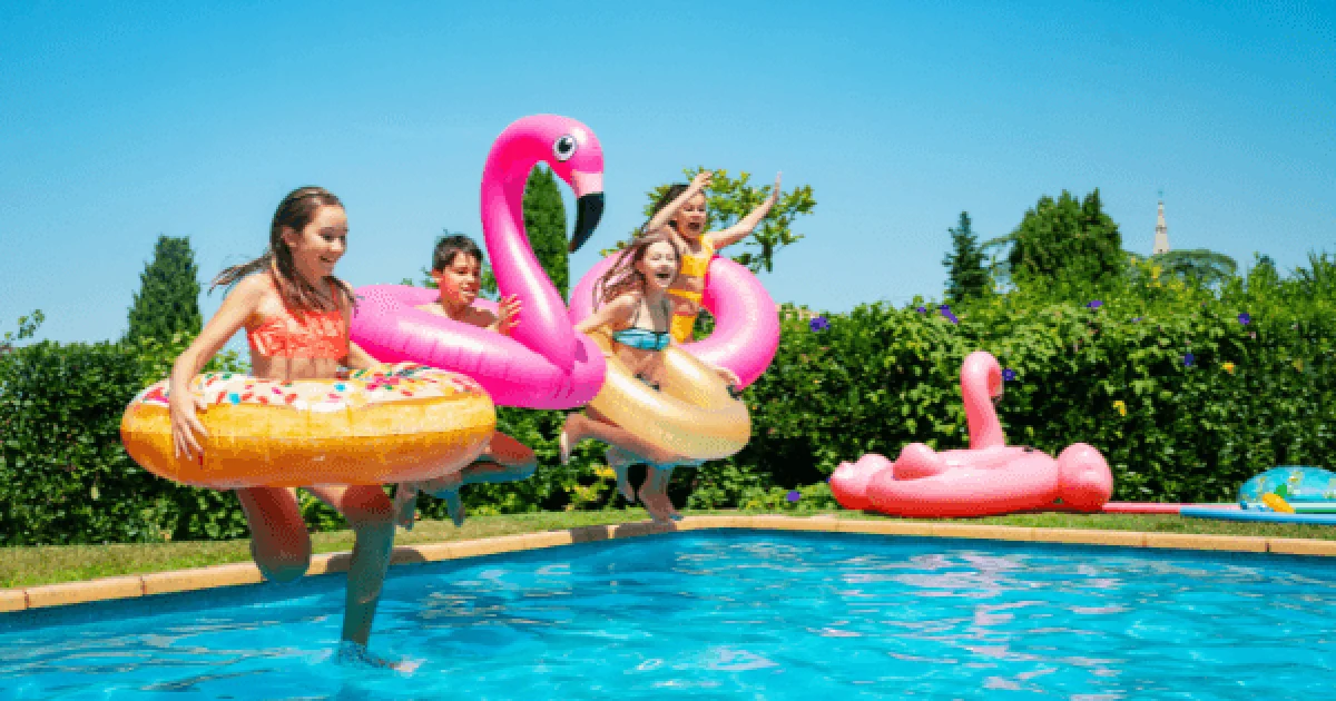kids in pool floats jumping in pool