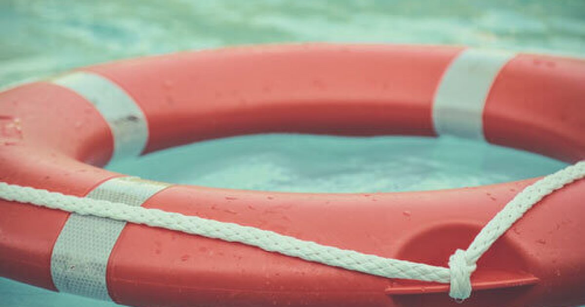 red and white life ring buoy