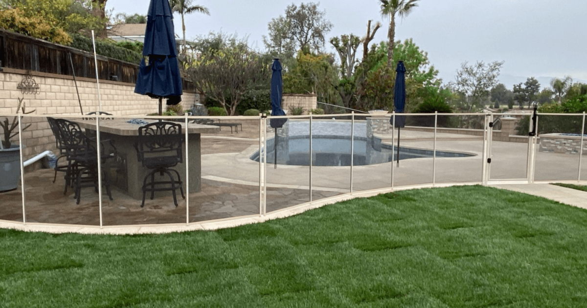 white mesh removable pool fence installed by All-Safe